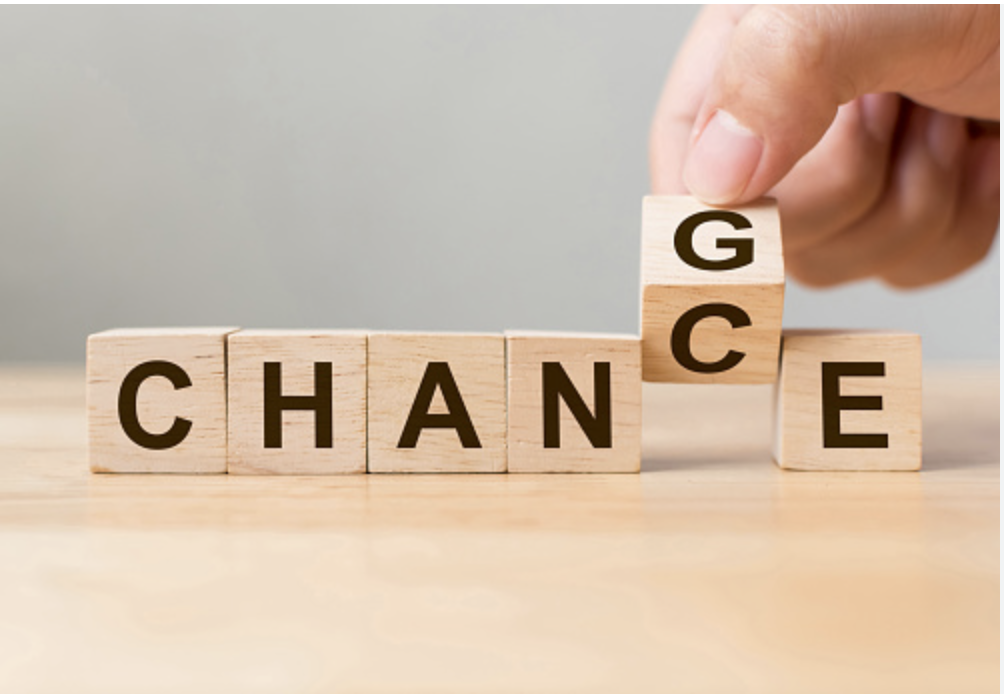Blocks spelling "Change" with one letter turning so that it spells 'Chance"